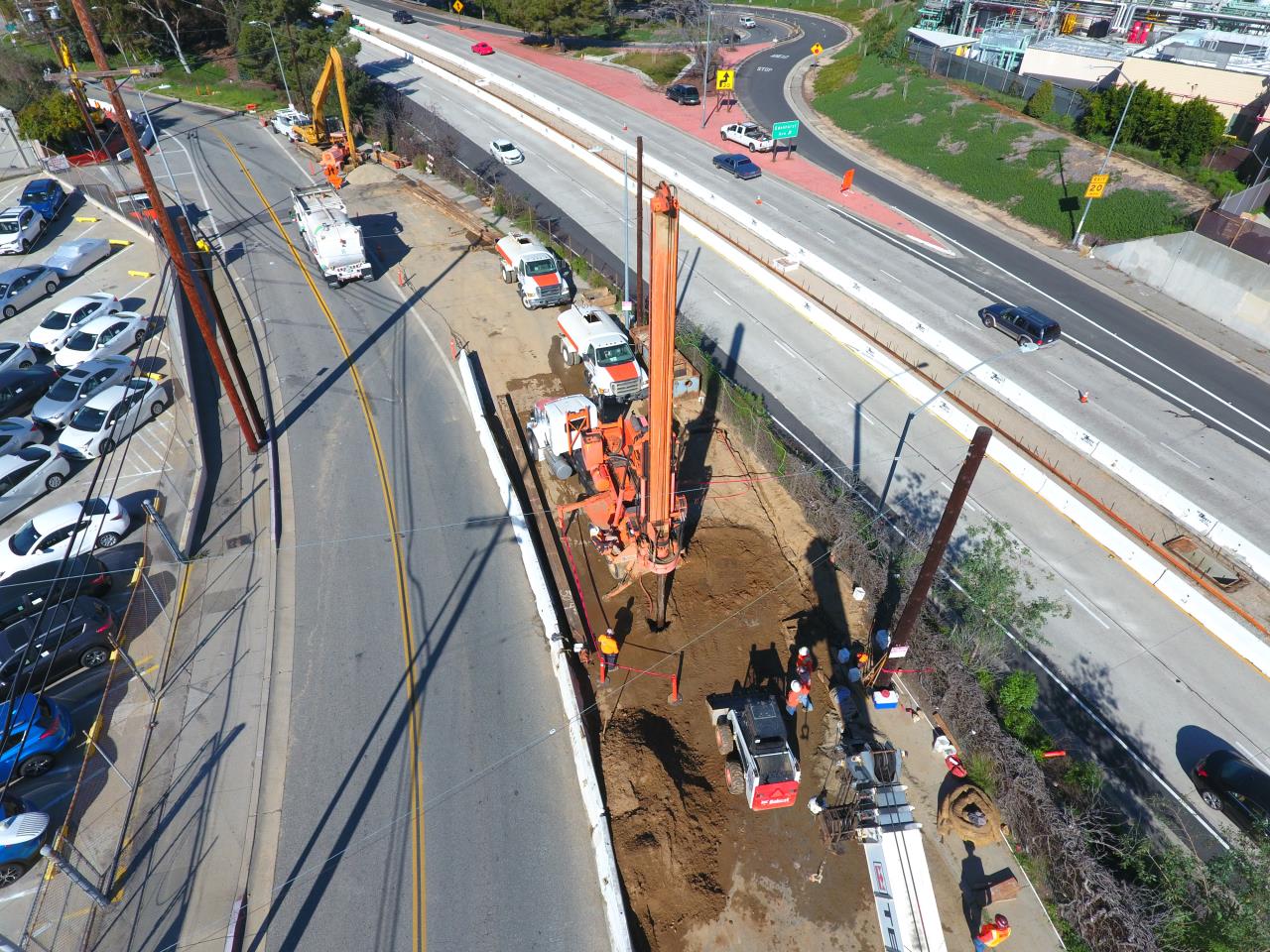 photo overhead view of freeway and parking lot and construction site