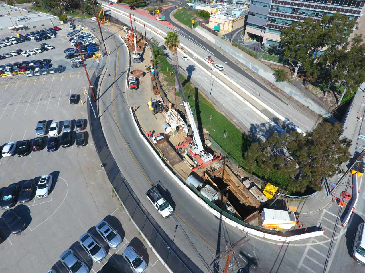 photo overhead view of freeway and parking lot and construction site