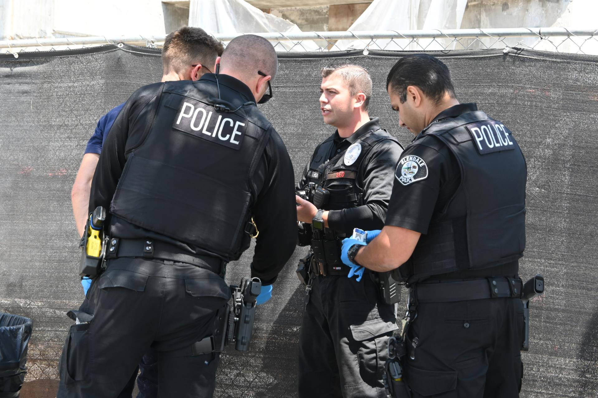 Officers detaining suspect